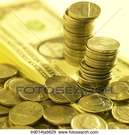 finance/a coin tower on a paper money View Large Photo Image Stock Photo - finance/a coin tower on a paper money . Fotosearch