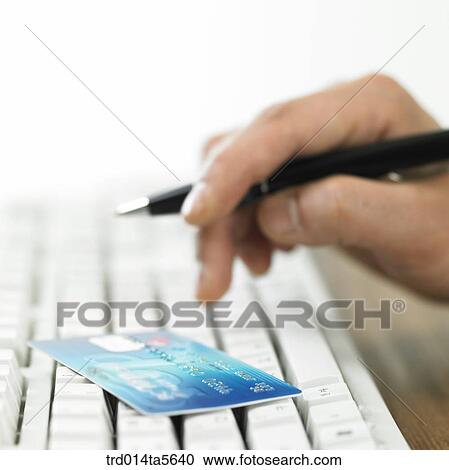 finance/a credit card and a hand on a keyboard View Large Photo Image Stock Image - finance/a credit card and a hand on a keyboard. Fotosearch