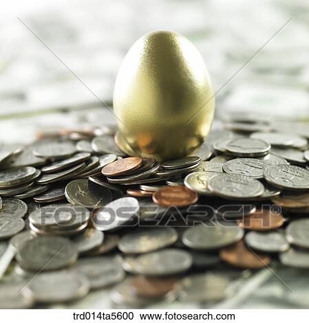 finance/a golden egg on a coin View Large Photo Image Stock Image - finance/a golden egg on a coin. Fotosearch