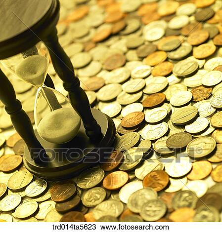 finance/a hourglass on coins View Large Photo Image Stock Image - finance/a hourglass on coins . Fotosearch