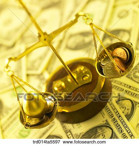 finance/a scale and golden egg coins on a paper money View Large Photo Image Stock Photo - finance/a scale and golden egg coins on a paper money. Fotosearch