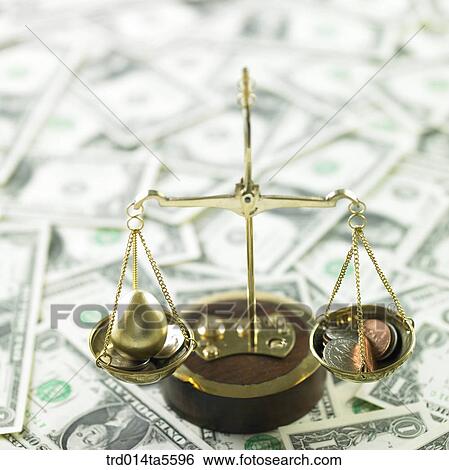 finance/a scale and golden egg coins on a paper money View Large Photo Image Stock Photograph - finance/a scale and golden egg coins on a paper money. Fotosearch