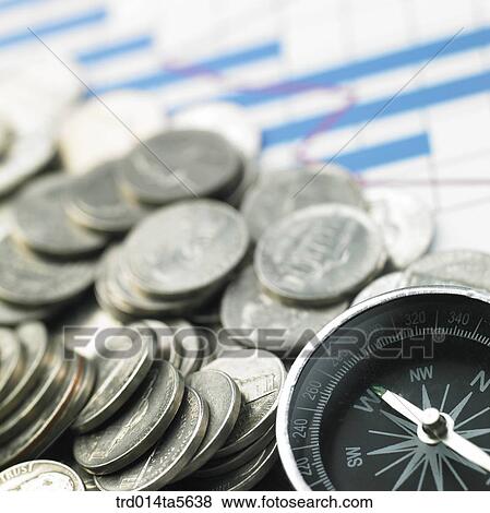finance/coins and a compass View Large Photo Image Stock Photo - finance/coins and a compass. Fotosearch