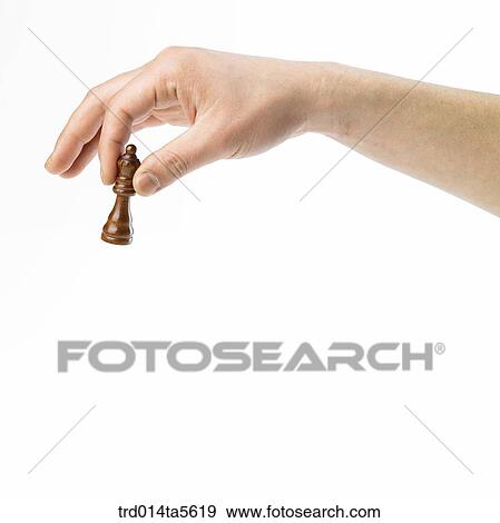 game/a hand holding a chess View Large Photo Image Stock Photo - game/a hand holding a chess. Fotosearch