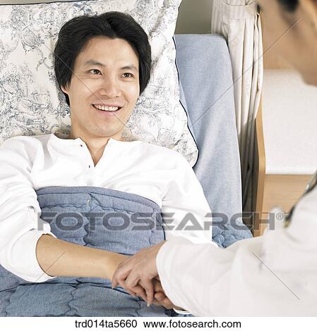 Stock Image - medicine/ a doctor and a patient. Fotosearch