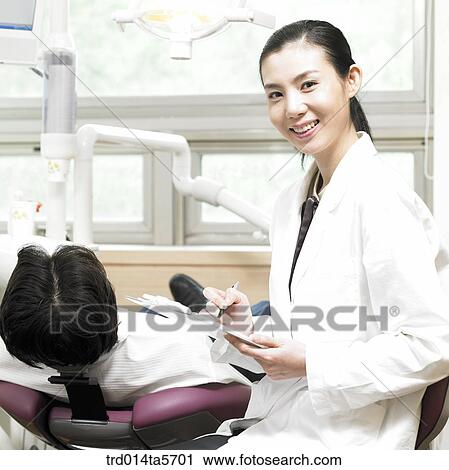 Stock Image - medicine/ a doctor and a patient. Fotosearch