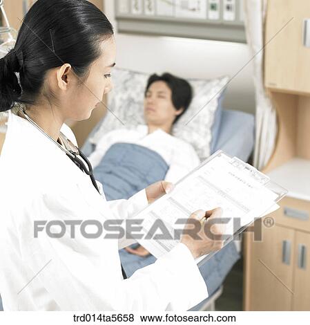 Stock Photo - medicine/ a doctor and a patient. Fotosearch