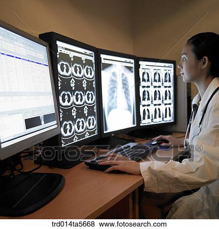 medicine/ a doctor and a patient looking at MRI pictures View Large Photo Image Stock Photo - medicine/ a doctor and a patient looking at MRI pictures. Fotosearch