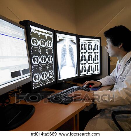 medicine/ a doctor and a patient looking at MRI pictures View Large Photo Image Stock Photo - medicine/ a doctor and a patient looking at MRI pictures. Fotosearch