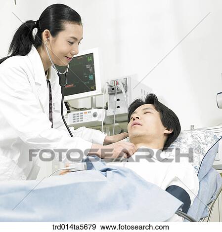 Stock Photo - medicine/ a doctor and a patient. Fotosearch