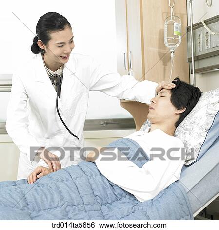 Stock Photograph - medicine/ a doctor and a patient. Fotosearch