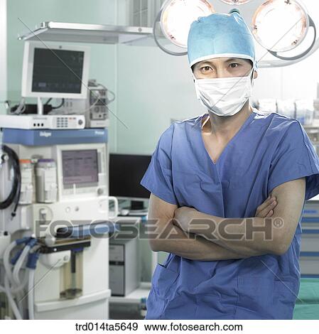 Stock Photo - medicine/ a doctor in an operating room. Fotosearch
