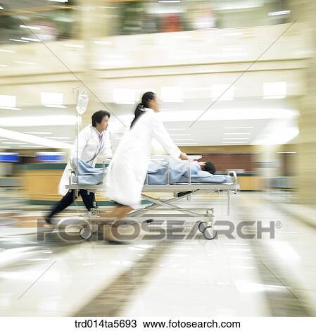 medicine/ a doctor moving an emergent patient View Large Photo Image Stock Image - medicine/ a doctor moving an emergent patient. Fotosearch