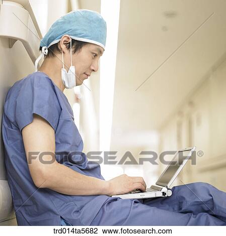Stock Image - medicine/ a doctor with a notebook. Fotosearch