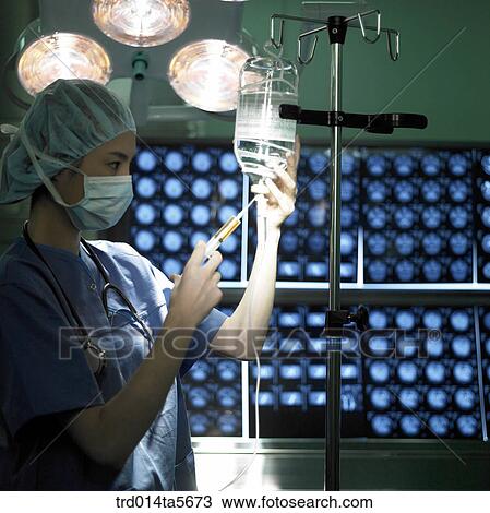 Stock Image - medicine/ a doctor with Ringer´s solution. Fotosearch