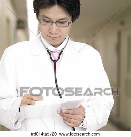 medicine/ a doctor writing a medical chart View Large Photo Image Stock Image - medicine/ a doctor writing a medical chart. Fotosearch