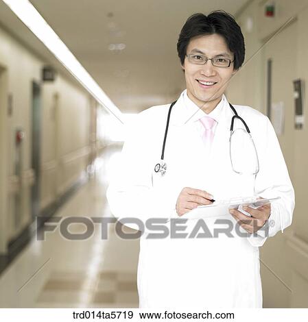 medicine/ a doctor writing a medical chart View Large Photo Image Stock Photo - medicine/ a doctor writing a medical chart. Fotosearch
