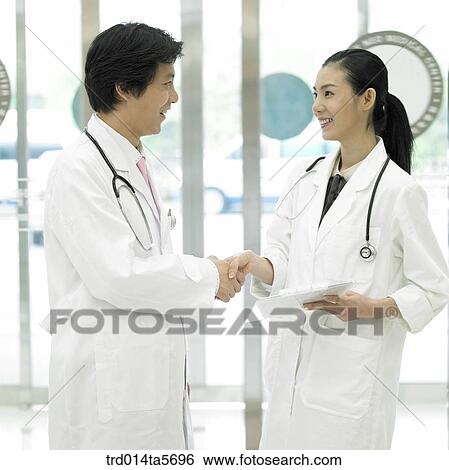 Stock Photograph - medicine/ doctors shaking hands. Fotosearch
