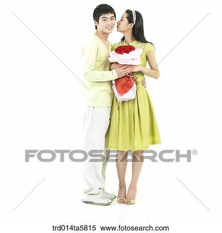 a boy giving a rose bouquet to his girl friend View Large Photo Image Stock Photography - a boy giving a rose bouquet to his girl friend. Fotosearch