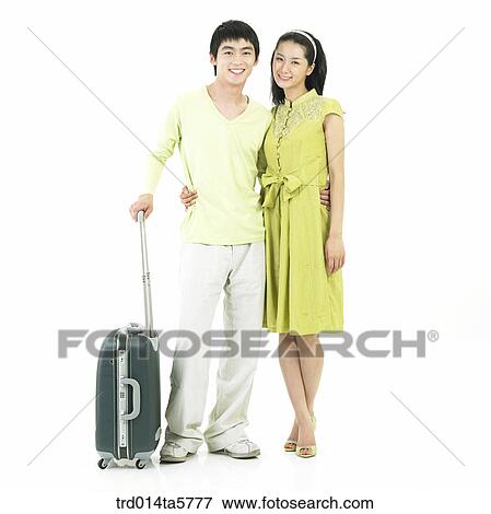 Stock Photo - a couple for a trip. Fotosearch