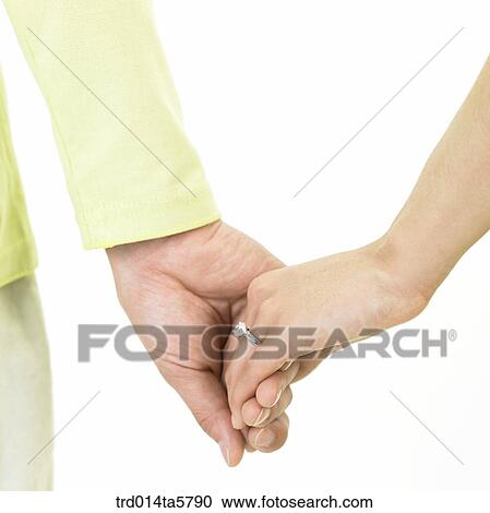 a couple holding hands View Large Photo Image Stock Image - a couple holding hands. Fotosearch