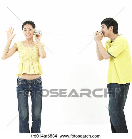 a couple playing with a telephone View Large Photo Image Picture - a couple playing with a telephone. Fotosearch