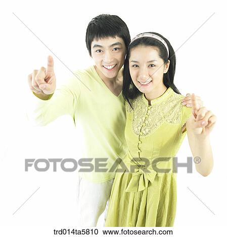 Stock Image - a couple taking a picture. Fotosearch