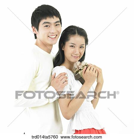 Stock Image - a couple with a gift. Fotosearch
