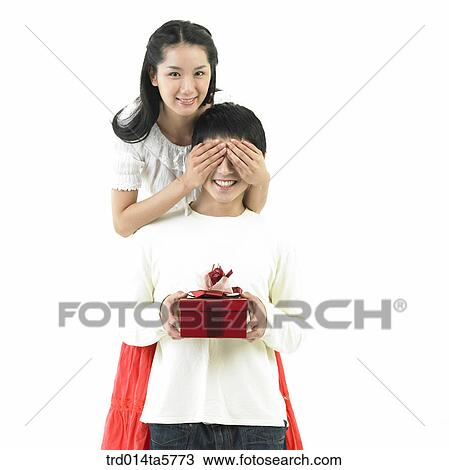 Stock Image - a couple with a gift. Fotosearch