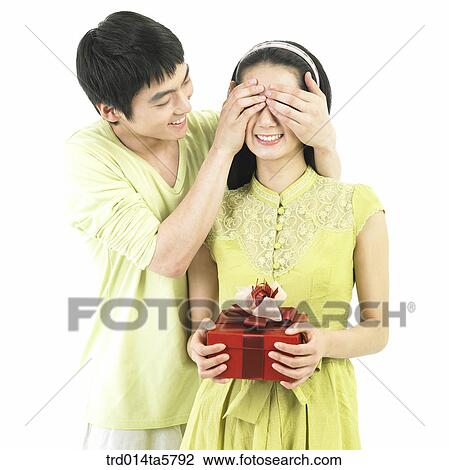 a couple with a gift View Large Photo Image Stock Image - a couple with a gift. Fotosearch