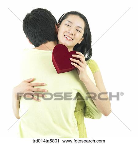 a couple with a gift View Large Photo Image Stock Image - a couple with a gift. Fotosearch