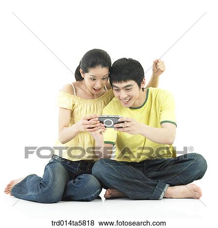 a couple with a PDA View Large Photo Image Stock Photo - a couple with a PDA. Fotosearch