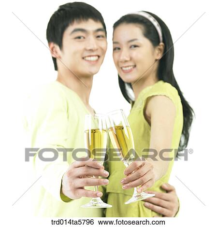 a drinking and smiling couple View Large Photo Image Stock Photograph - a drinking and smiling couple. Fotosearch