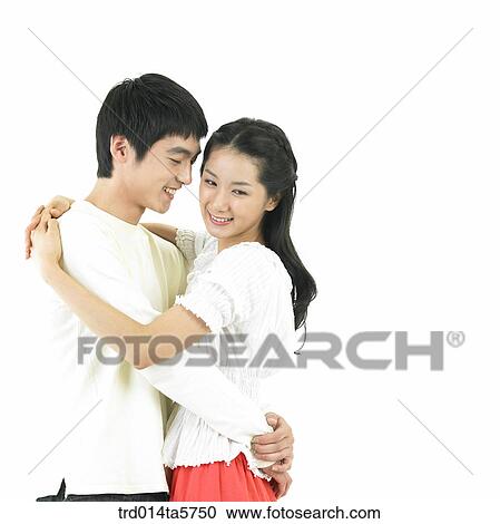 Stock Image - a hugging couple. Fotosearch