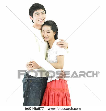 Stock Image - a hugging couple. Fotosearch