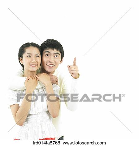 Stock Photo - a hugging couple. Fotosearch