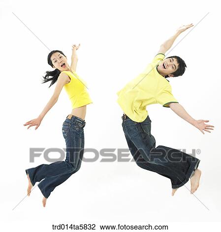 Stock Image - a jumping couple. Fotosearch