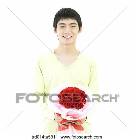 a man holding a rose bouquet View Large Photo Image Stock Image - a man holding a rose bouquet. Fotosearch