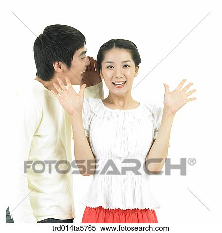 Stock Photography - a whispering couple. Fotosearch