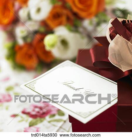 a bouquet, a gift box and a card on the table View Large Photo Image Stock Image - a bouquet, a gift box and a card on the table. Fotosearch