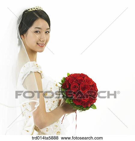 a bride holding a bouquet View Large Photo Image Stock Photo - a bride holding a bouquet. Fotosearch