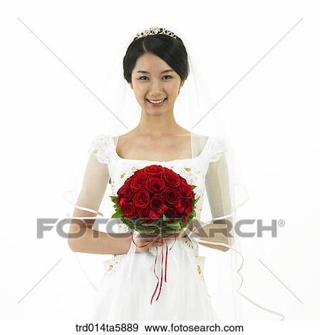 a bride holding a bouquet View Large Photo Image Stock Photo - a bride holding a bouquet. Fotosearch