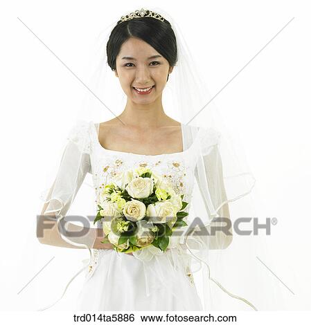a bride holding a bouquet View Large Photo Image Stock Photograph - a bride holding a bouquet. Fotosearch
