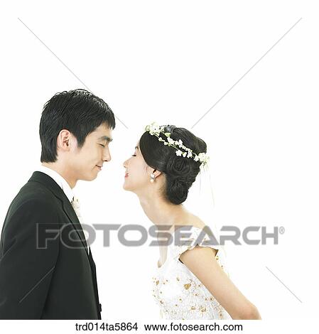 a bridegroom and a bride facing each other View Large Photo Image Picture - a bridegroom and a bride facing each other. Fotosearch