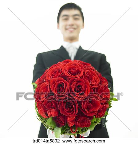 a bridegroom holding a bouquet View Large Photo Image Stock Image - a bridegroom holding a bouquet. Fotosearch