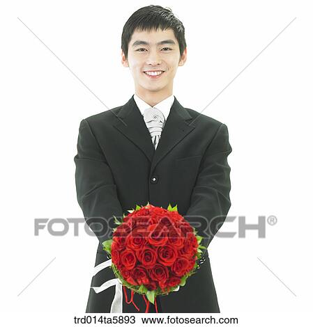 a bridegroom holding a bouquet View Large Photo Image Stock Image - a bridegroom holding a bouquet. Fotosearch