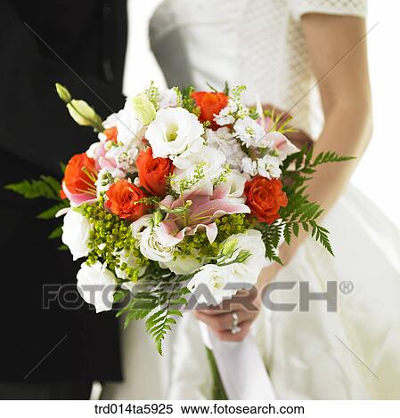a bride's hands with a bouquet View Large Photo Image Stock Photography - a bride's hands with a bouquet. Fotosearch