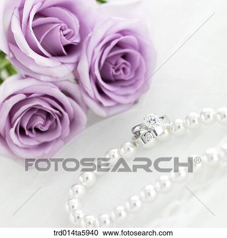 a rose and a gift on the table View Large Photo Image Stock Image - a rose and a gift on the table. Fotosearch