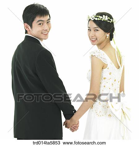 holding hands a bridegroom and a bride View Large Photo Image Stock Image - holding hands a bridegroom and a bride. Fotosearch