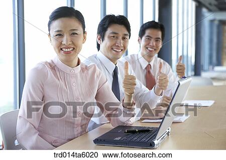 a businessman and a businesswoman in a conference room View Large Photo Image Stock Image - a businessman and a businesswoman in a conference room. Fotosearch